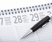 black wooden pen on calendar agenda